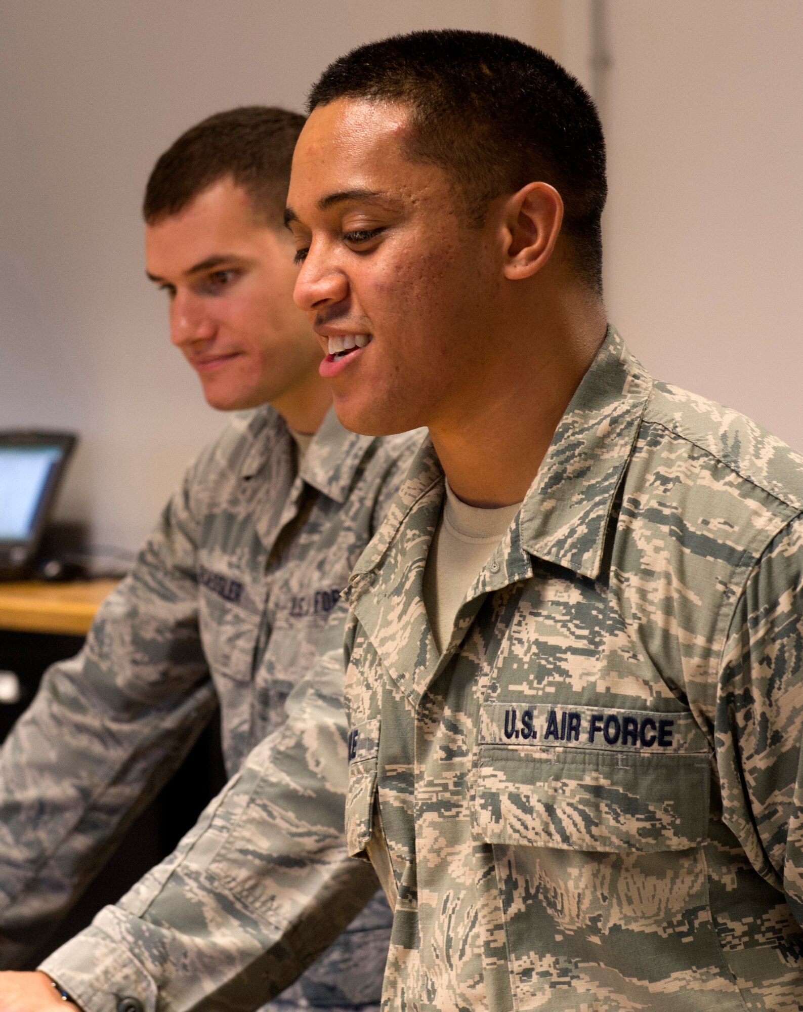 U.S. Air Force Senior Airman Pesamio Mikaele, 52nd Operations Support Squadron aircrew flight operations technician, front, and Senior Airman Daniel Roessler, 52nd Operations Support Squadron aircrew flight operations technician, back, observe wing leaders pack survival bags during a Saber leadership “out and about” event at the parachute shop on Spangdahlem Air Base, Germany, Sept. 8, 2016. The event lets the 52nd FW commander and command chief get a hands on experience at Saber work centers in an effort to better understand the duties of Airmen at Spangdahlem. (U.S. Air Force photo by Airman 1st Class Preston Cherry/Released)