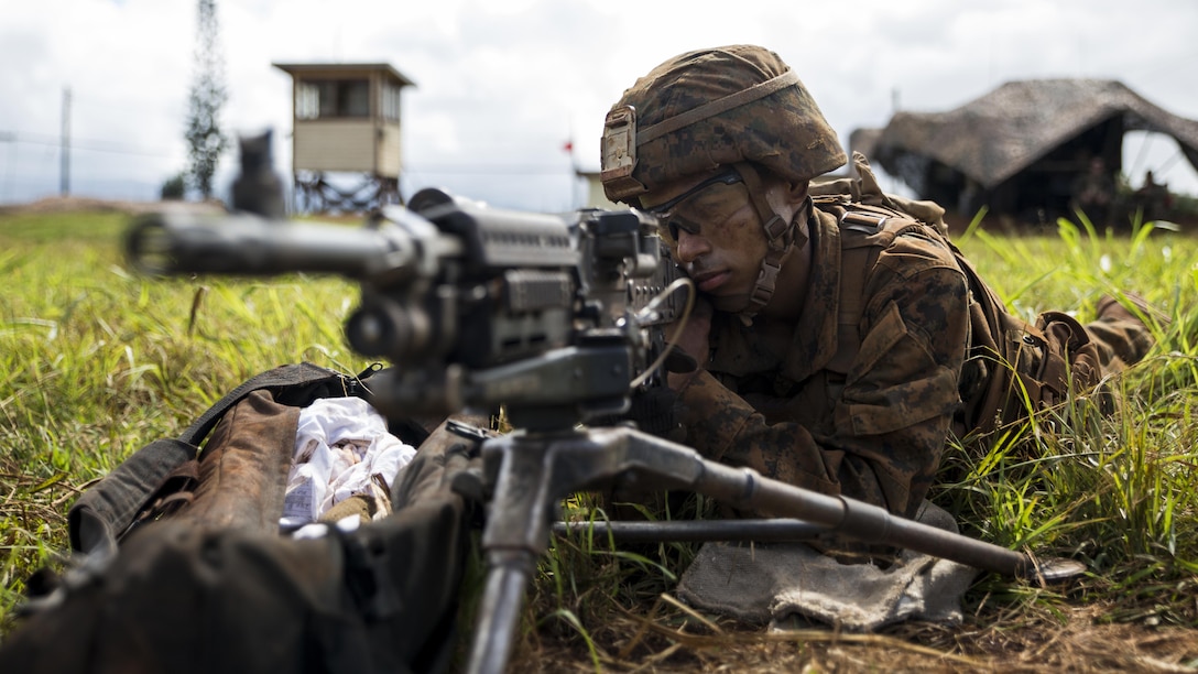 Pfc. Jeremiah Overton, an artilleryman with Bravo Company, “Black Sheep,” 1st Battalion, 12th Marine Regiment, and a Loraine, Ohio, native, provides security with his M240 Machine Gun for M777 Light Weight Towed Howitzers and their artillerymen during a training exercise at Marine Corps Base Hawaii, Sept. 06, 2016. Marines from Bravo Co., “Black Sheep,” 1st Bn., 12th Marines, participated in exercise Spartan Fury 16.4. Spartan Fury is a pre-deployment exercise in which service members conduct live-fire artillery training and unit leaders are able to further assess and improve the lethality of the battalion.