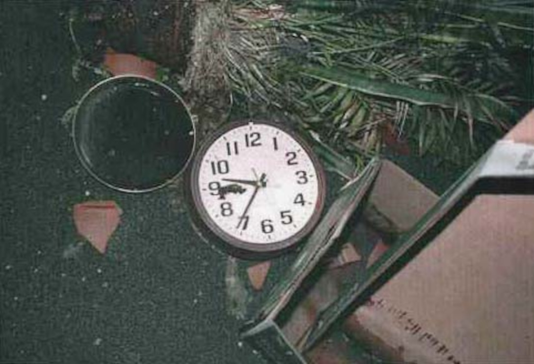 A stopped clock lies where it fell in Room 3E452, located near the "hinge" of the floors that collapsed following the 9/11 attack on the Pentagon. The 9/11 Commission determined that the plane hit the building at 9:37 a.m. Navy photo