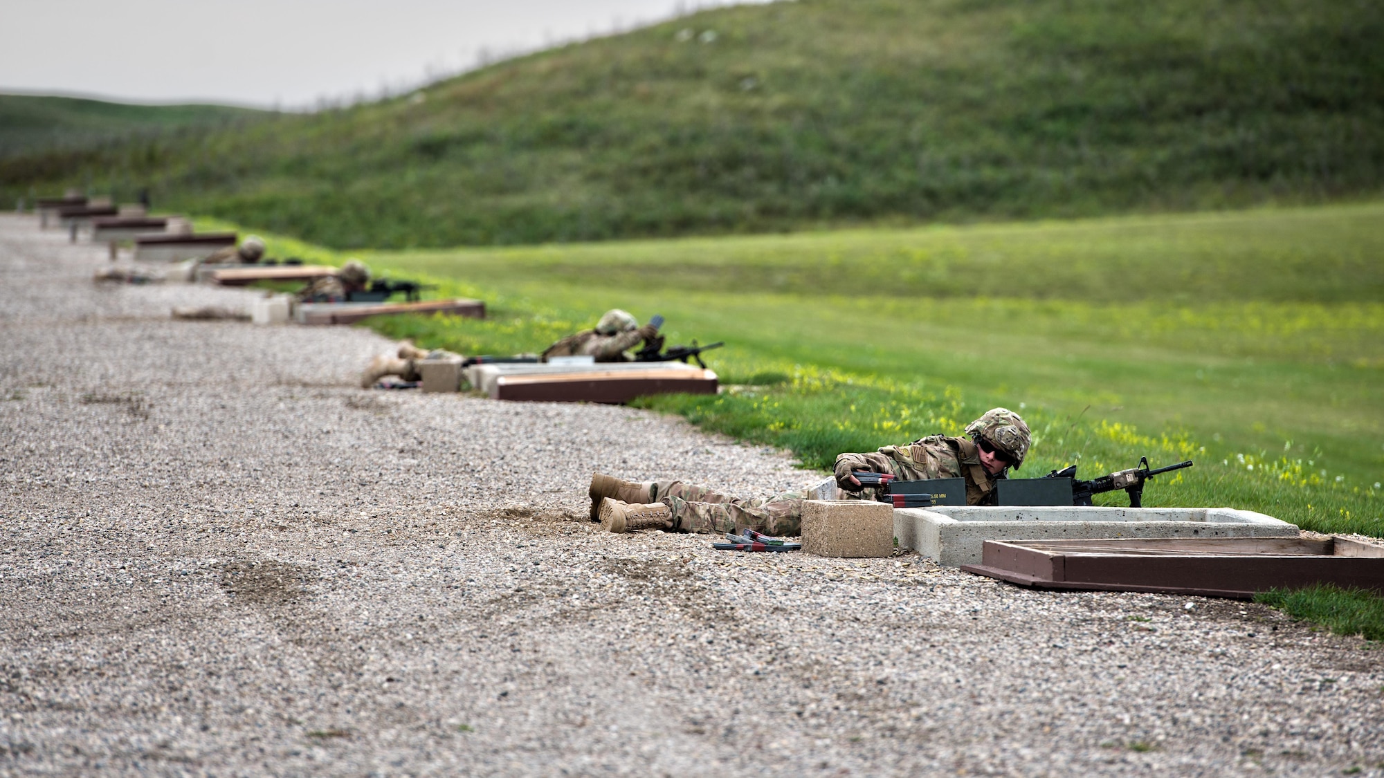 Defenders from the 91st Security Forces Group change magazines at the U.S. Army range at Camp Grafton Training Center, N.D., Sept. 7, 2016. Defenders utilized the range to practice engaging targets from 50 to 300 m. (U.S. Air Force photo/Airman 1st Class J.T. Armstrong)