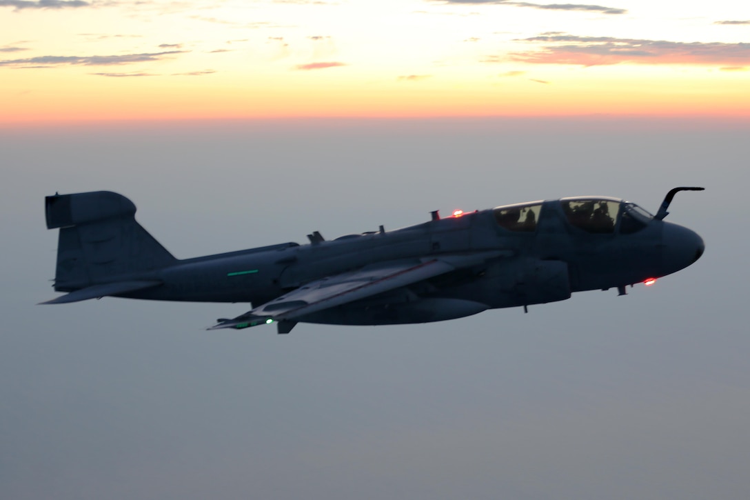 An EA-6B Prowler soars through the evening sky during an aerial refueling mission over the Atlantic Ocean Sept. 7, 2016. The mission of Marine Aerial Refueler Transport Squadron 252 is to support the Marine Air Ground Task Force commander by providing air-to-air refueling, assault support, and offensive air support, day or night under all weather conditions during expeditionary, joint, or combined operations.  VMGR-252 conducted aerial refuels for AV-8B Prowlers, EA-6B Harriers, and F-35B Lightnings off the coast of North Carolina to provide routine training for both the pilots and crew members. (U.S. Marine Corps Photo by Lance Cpl. Mackenzie Gibson/Released)