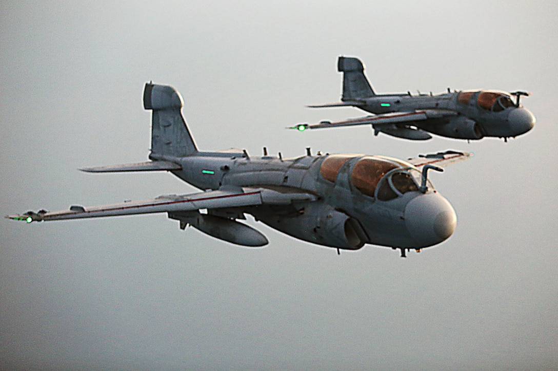 Two EA-6B Prowlers fly closely behind a KC-130J Super Hercules during an aerial refueling mission over the Atlantic Ocean Sept. 7, 2016. The mission of Marine Aerial Refueler Transport Squadron 252 is to support the Marine Air Ground Task Force commander by providing air-to-air refueling, assault support, and offensive air support, day or night under all weather conditions during expeditionary, joint, or combined operations.  VMGR-252 conducted aerial refuels for AV-8B Prowlers, EA-6B Harriers, and F-35B Lightnings off the coast of North Carolina to provide routine training for both the pilots and crew members. (U.S. Marine Corps Photo by Lance Cpl. Mackenzie Gibson/Released)