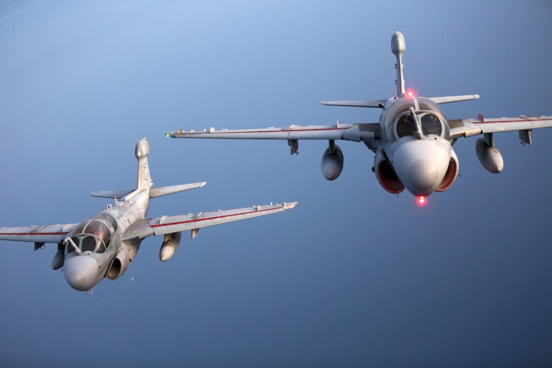 Two EA-6B Prowlers fly over the evening sky during an aerial refueling mission over the Atlantic Ocean Sept. 7, 2016. The mission of Marine Aerial Refueler Transport Squadron 252 is to support the Marine Air Ground Task Force commander by providing air-to-air refueling, assault support, and offensive air support, day or night under all weather conditions during expeditionary, joint, or combined operations.  VMGR-252 conducted aerial refuels for AV-8B Prowlers, EA-6B Harriers, and F-35B Lightnings off the coast of North Carolina to provide routine training for both the pilots and crew members. (U.S. Marine Corps Photo by Lance Cpl. Mackenzie Gibson/Released)
