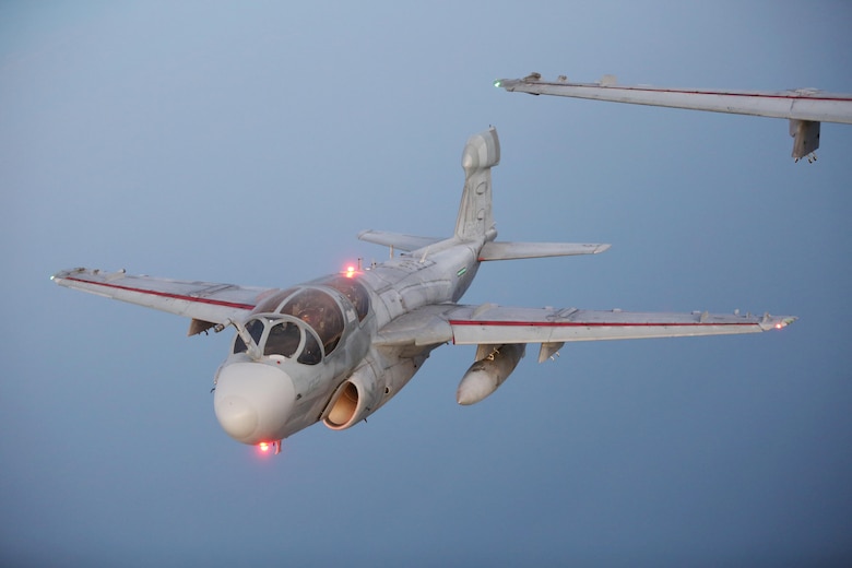 An EA-6B Prowler flies closely behind a KC-130J Super Hercules during an aerial refueling mission over the Atlantic Ocean Sept. 7, 2016. The mission of Marine Aerial Refueler Transport Squadron 252 is to support the Marine Air Ground Task Force commander by providing air-to-air refueling, assault support, and offensive air support, day or night under all weather conditions during expeditionary, joint, or combined operations.  VMGR-252 conducted aerial refuels for AV-8B Prowlers, EA-6B Harriers, and F-35B Lightnings off the coast of North Carolina to provide routine training for both the pilots and crew members. (U.S. Marine Corps Photo by Lance Cpl. Mackenzie Gibson/Released)