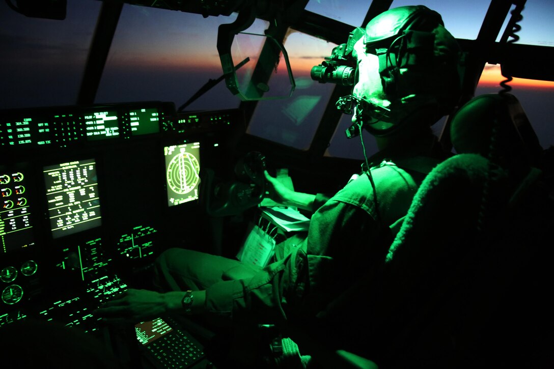 Maj. Janine Garner pilots a KC-130J Super Hercules with Marine Aerial Refueler Transport Squadron 252 during an aerial refueling mission over the Atlantic Ocean Sept. 7, 2016. The mission of VMGR-252 is to support the Marine Air Ground Task Force commander by providing air-to-air refueling, assault support, and offensive air support, day or night under all weather conditions during expeditionary, joint, or combined operations.  The squadron conducts aerial refuels for AV-8B Prowlers, EA-6B Harriers, and F-35B Lightnings off the coast of North Carolina to provide routine training for both the pilots and crew members. Garner is a KC-130 aircraft commander with MAG-14. (U.S. Marine Corps Photo by Lance Cpl. Mackenzie Gibson/Released)