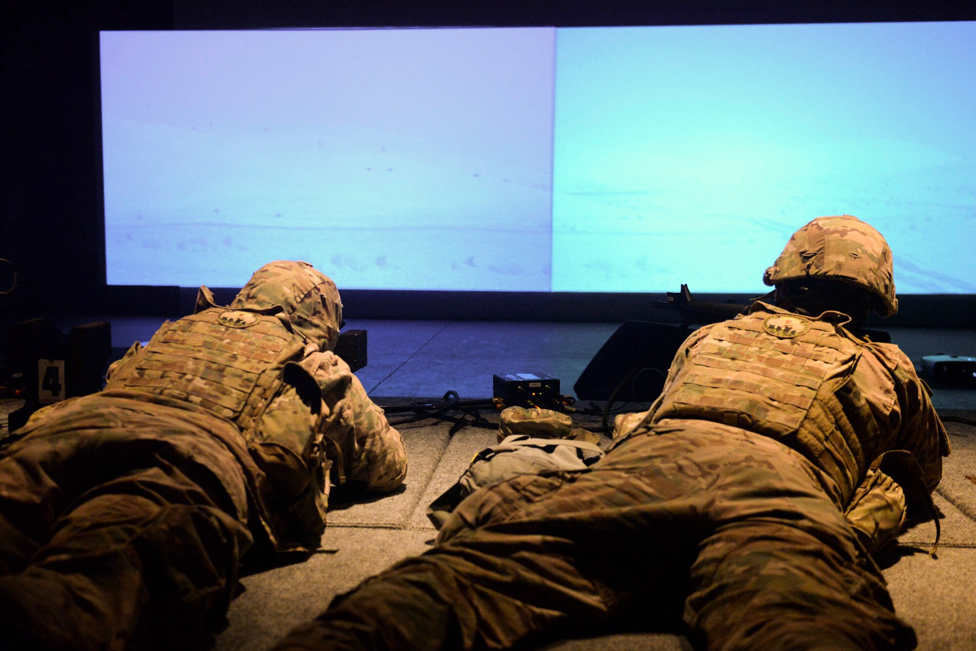 Airmen from the 91st Missile Security Forces Squadron use the U.S. Army’s Engagement Skills Trainer 2000 at the Camp Grafton Training Center in Devils Lake, N.D., Sept. 7, 2016. The EST 2000 is a firearms training simulator that allows Airmen to focus on firing position, breathing and sight alignment. (U.S. Air Force photo/Airman 1st Class Jessica Weissman)