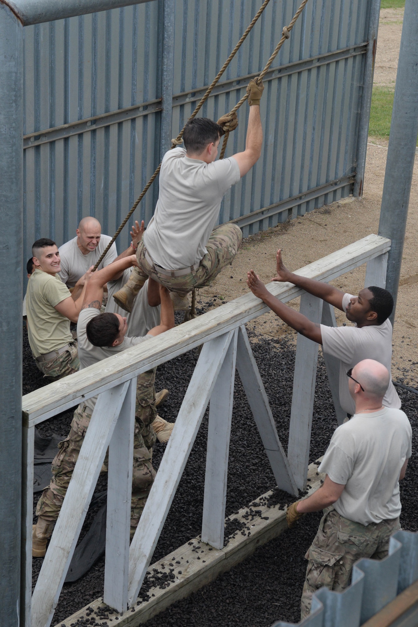 Airmen from the 91st Missile Security Forces Squadron maneuver through an obstacle at the Camp Grafton Training Center in Devils Lake, N.D., Sept. 7, 2016. This obstacle course increased leadership skills and communication throughout the unit. (U.S. Air Force photo/Airman 1st Class Jessica Weissman)