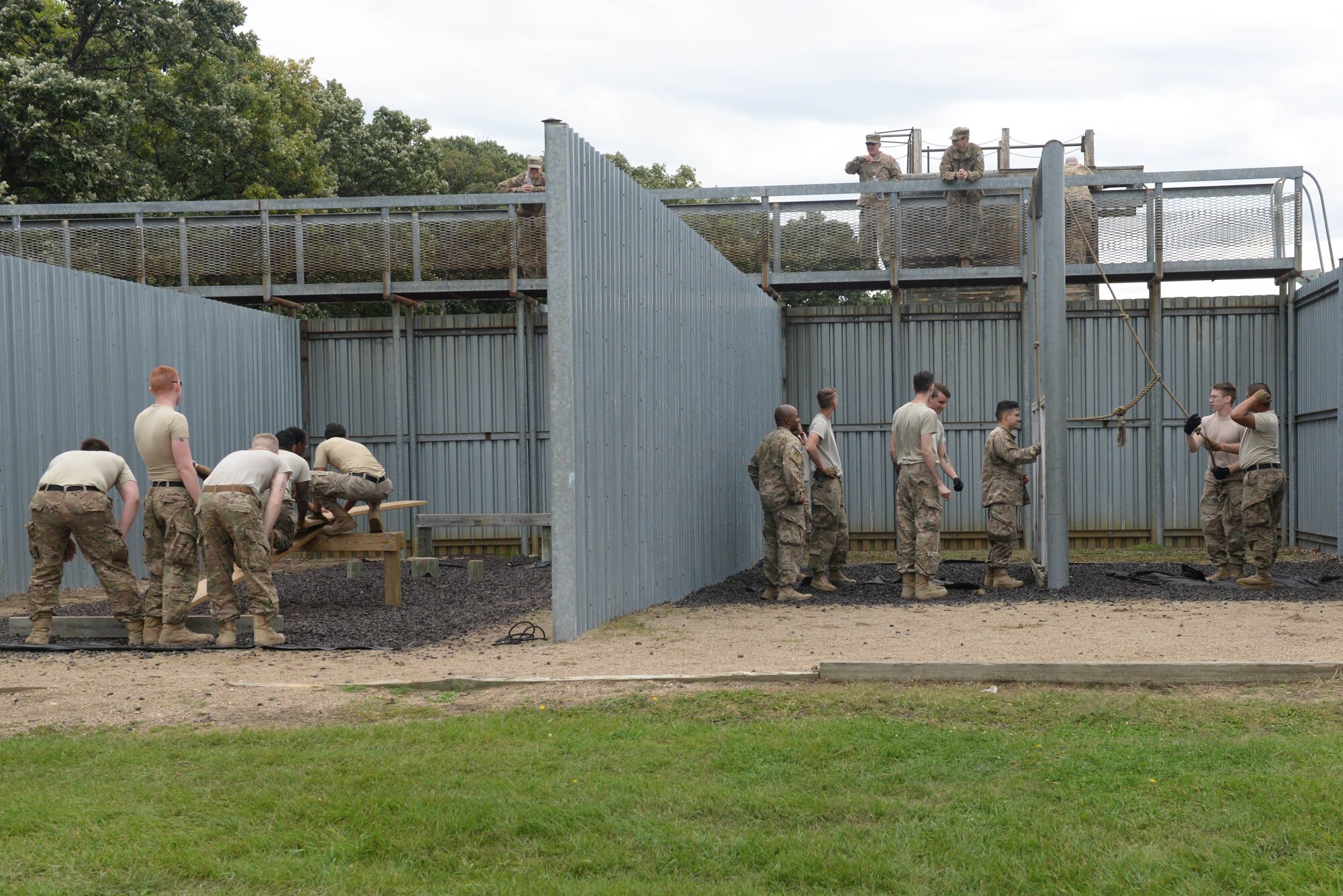 Airmen from the 91st Missile Security Forces Squadron participate in a leadership reaction course at the Camp Grafton Training Center in Devils Lake, N.D., Sept. 7, 2016. The leadership reaction course, part of a three-day training event, taught team building and increased leadership skills. (U.S. Air Force photo/Airman 1st Class Jessica Weissman)