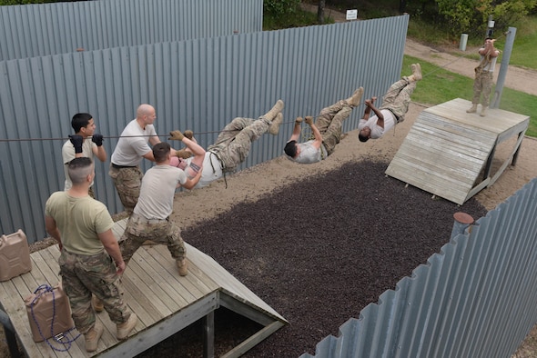 Airmen from the 91st Missile Security Forces Squadron participate in a leadership reaction course at the Camp Grafton Training Center in Devils Lake, N.D., Sept. 7, 2016.Various obstacles were presented to Airmen to increase communication and leadership within the unit. (U.S. Air Force photo/Airman 1st Class Jessica Weissman)
