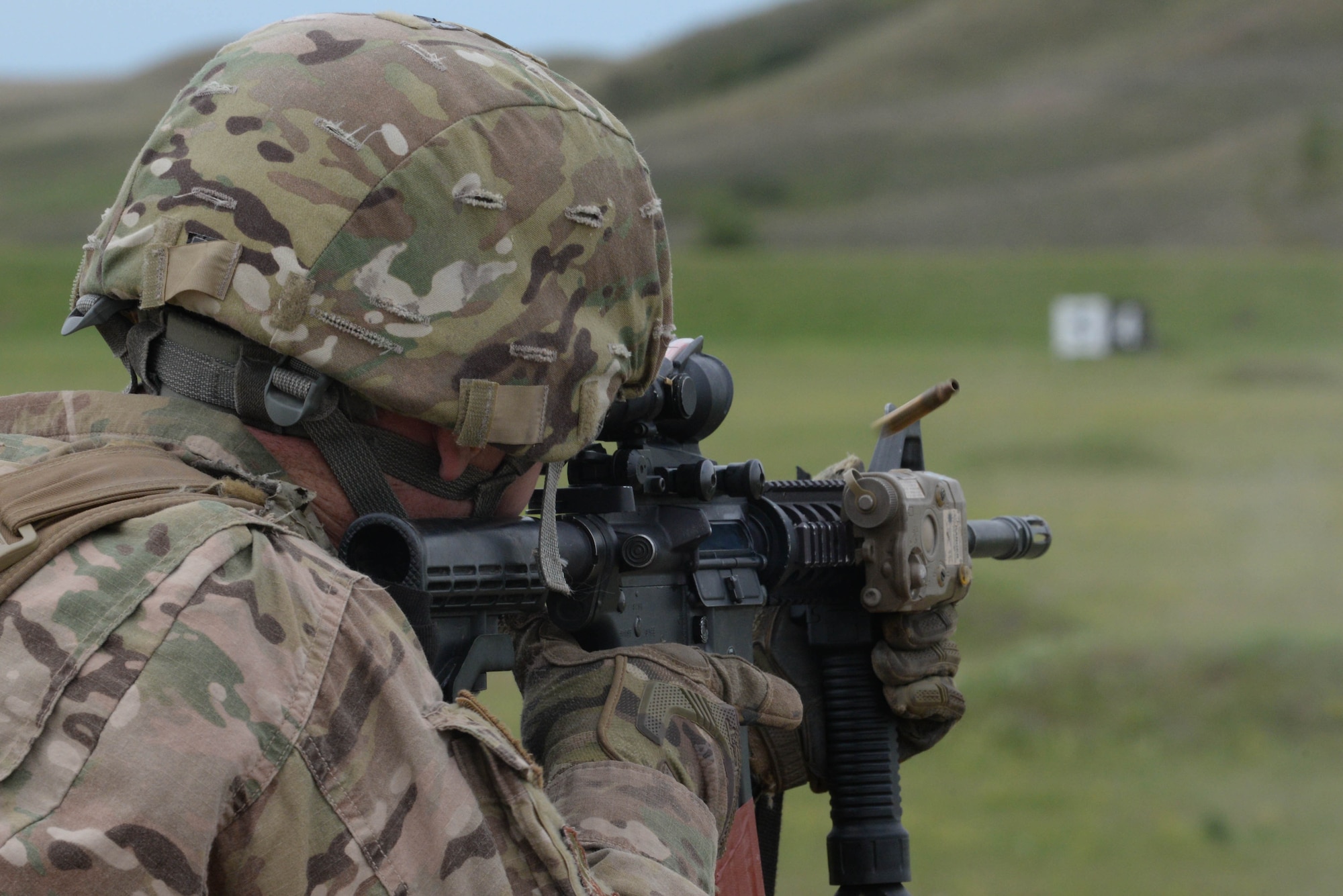 An Airman from the 91st Missile Security Forces Squadron fires an M4 at a weapons training range at the Camp Grafton Training Center in Devils Lake, N.D., Sept. 7, 2016. This range allows defenders stationed at Minot Air Force Base, N.D., to shoot targets at a distance of 300 m. (U.S. Air Force photo/Airman 1st Class Jessica Weissman)