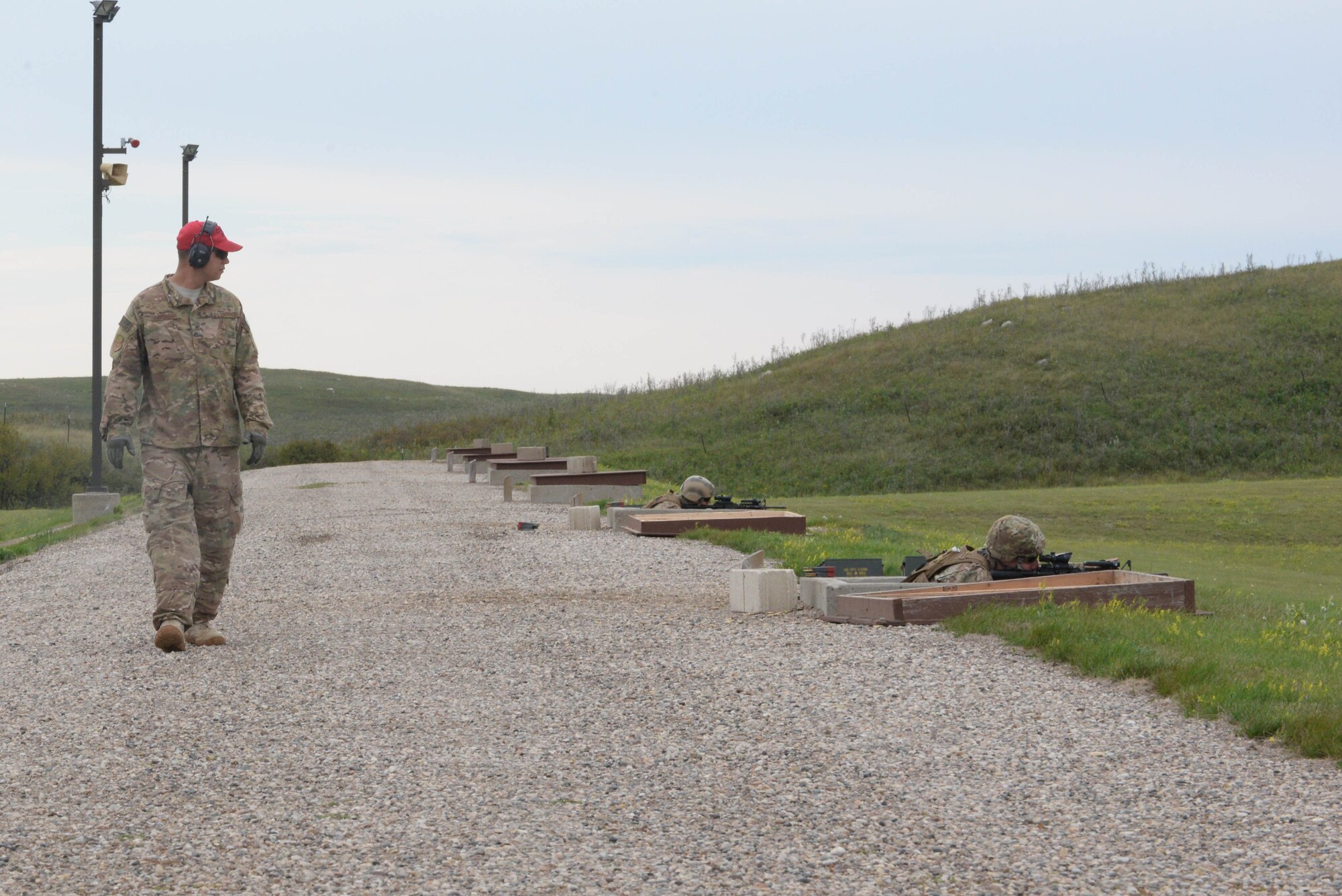 Staff Sgt. Matthew Cinciripini, a security forces instructor assigned to the 91st Security Support Squadron, monitors Airmen at a weapons training range at the Camp Grafton Training Center in Devils Lake, N.D., Sept. 7, 2016. Live-fire training was one of many courses that were part of a three-day training event to prepare Airmen for real life scenarios and improve combat capabilities. (U.S. Air Force photo/Airman 1st Class Jessica Weissman)