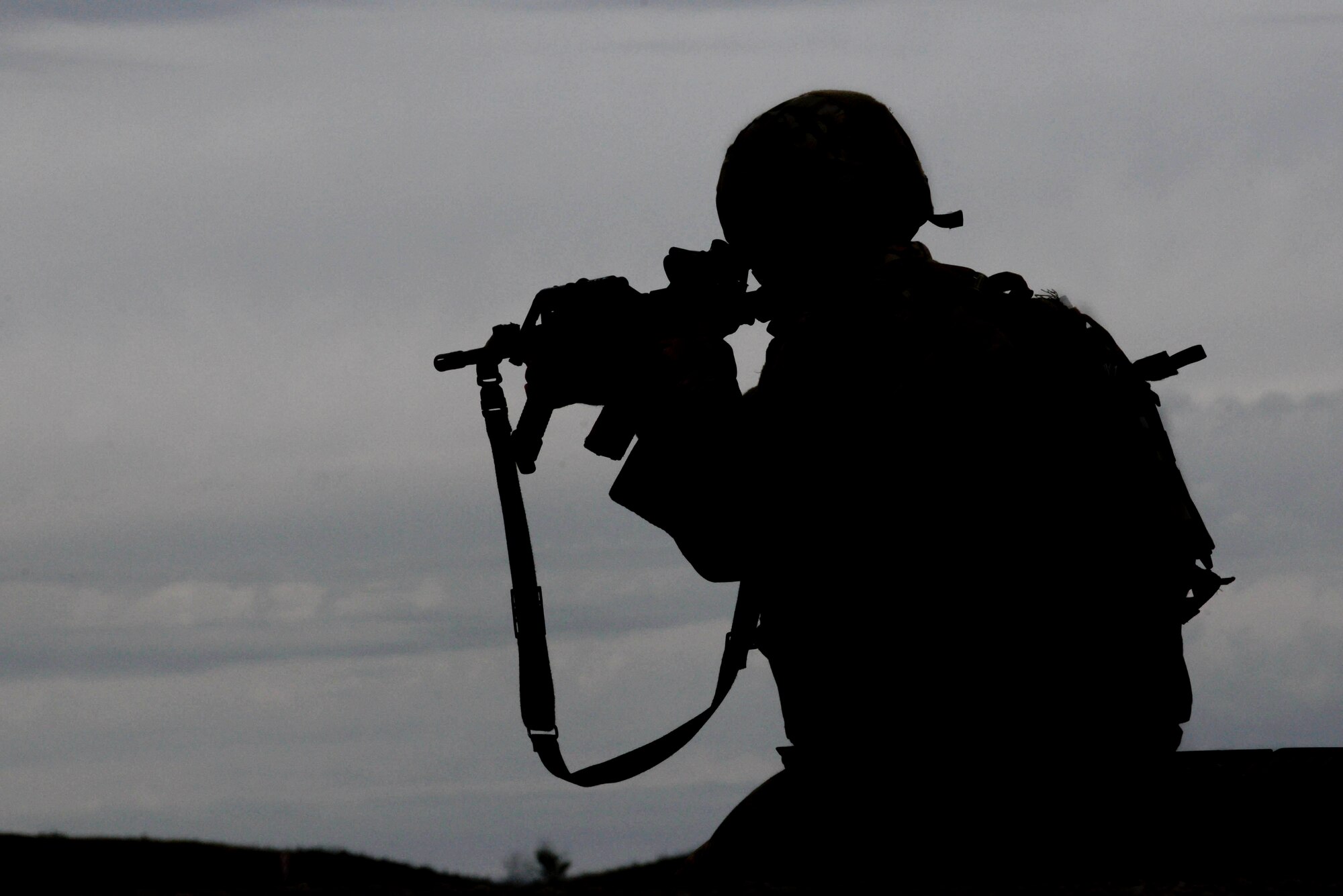 An Airman from the 91st Missile Security Forces Squadron fires an M4 at the Camp Grafton Training Center in Devils Lake, N.D., Sept. 7, 2016. During a three-day training event, Airmen completed a leadership reaction course, Humvee rollover training, virtual firing, live firing and a convoy course. (U.S. Air Force photo/Airman 1st Class Jessica Weissman)