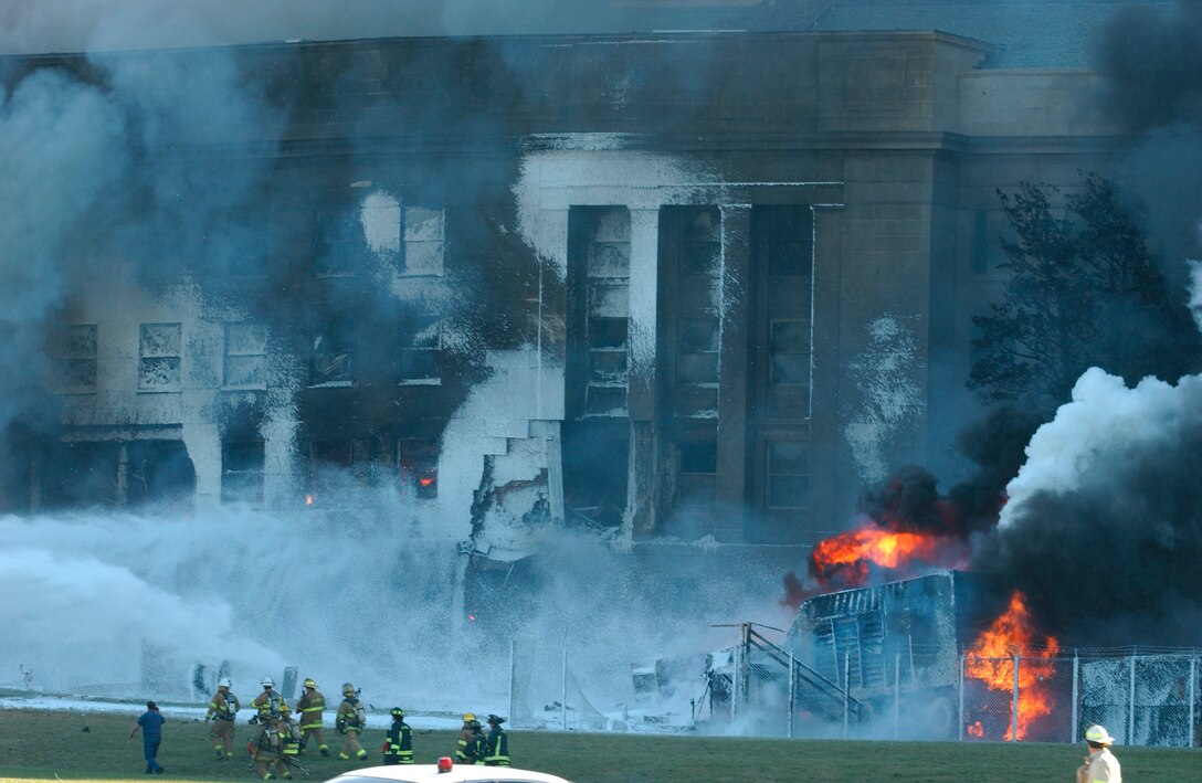 Local police, firefighting units and first responders battle to put out the fires raging in the Pentagon after a hijacked jetliner, American Airlines Flight 77, crashed into the south face of the building, Sept. 11, 2001. Marine Corps photo by Cpl. Jason Ingersoll 