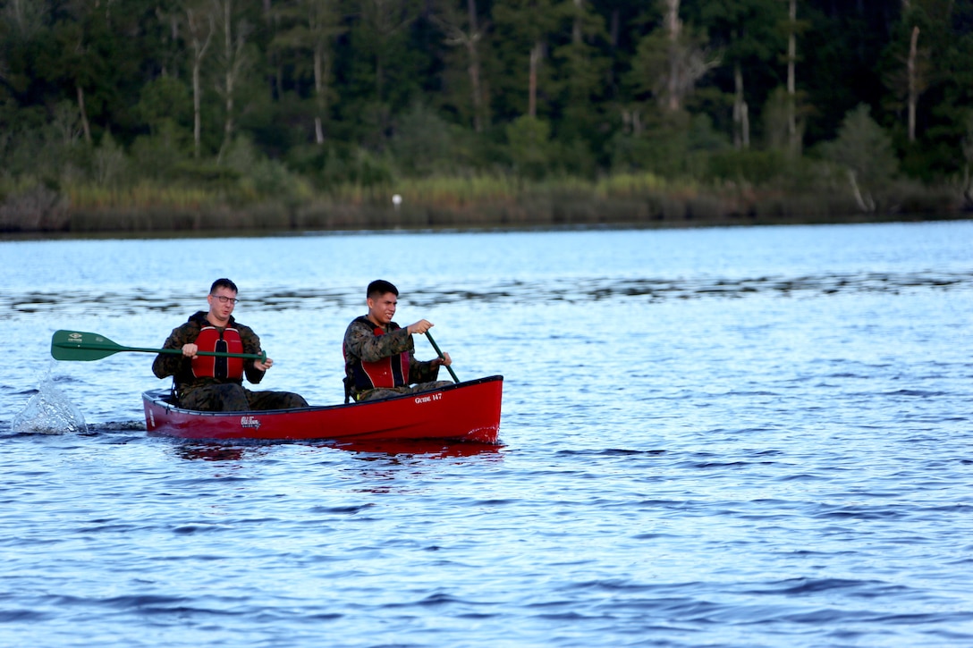 Marines assigned to Marine Tactical Air Command Squadron 28 kayak through a lake during their second annual Warrior Day at Marine Corps Air Station Cherry Point, N.C., Sept. 1, 2016. More than 50 Marines participated in MTACS-28's warrior day which included six different stations that incorporated ground fighting matches, an M-16 service rifle disassembly and reassembly, kayaking, radio set-up, repelling, and a 50-yard Humvee pull. Marines worked hand-in-hand to complete events as a team while sharing diverse leadership styles, years of experience and espirit de Corps. MTACS-28 is part of Marine Air Control Group 28, 2nd Marine Aircraft Wing. (U.S. Marine Corps photo by Cpl. Jason Jimenez/Released)