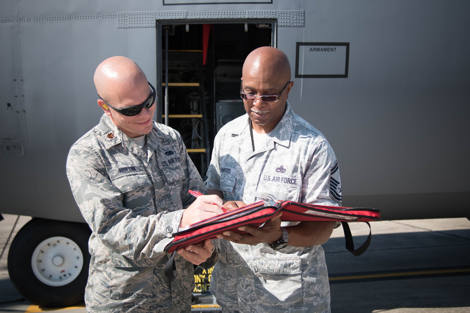Maj. Brian Horton, 803rd Aircraft Maintenance Squadron commander and Senior Master Sgt. Marshall Harris, 803rd AMXS flight chief review an aircraft maintenance checklist Aug. 22. The 403rd Wing will be gaining the new 803rd Aircraft Maintenance Squadron during an activation ceremony Sept. 11. (U.S. Air Force photo/Senior Airman Heather Heiney) 