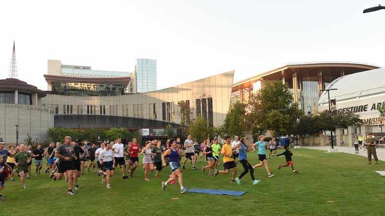 A group of Nashville residents form up for physical training with the Marines, Sept. 8, 2016, during the public PT event at the Walk of Fame Park in downtown Nashville as part of Marine Week. This event was one of many events hosted during Marine Week to help promote a greater relationship between the community and the Marine Corps.