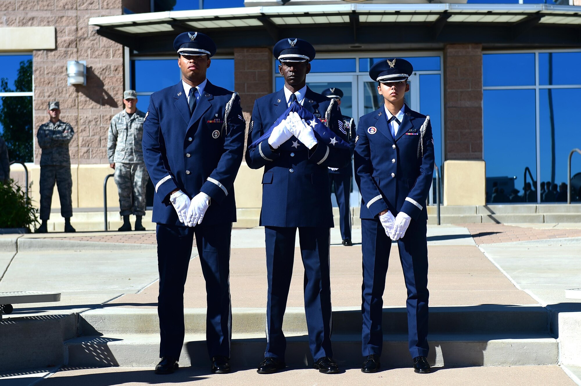 Mile High Honor Guard members stand as they wait to raise the American flag during a Patriot Day ceremony Sept. 9, 2016, on Buckley Air Force Base, Colo. Patriot Day, recognized by U.S. law as an official day of remembrance, has been observed every year since Sept. 11, 2001, and its tragic events. (U.S. Air Force photo by Airman 1st Class Gabrielle Spradling/Released)