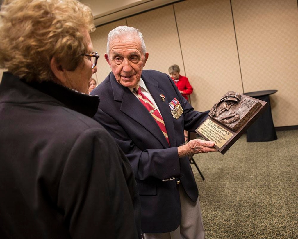 Lt. Gen. Richard E. Carey USMC (ret.) presents a plaque to Ellen R. Gordon, Chairman and Chief Executive Officer - Tootsie Roll Industries, Inc., at the Hyatt Regency, Dallas/Fort Worth International Airport, Sept. 8, 2016, for the support that Tootsie Rolls provided Marines during the Koran War. Marines requested a resupply of 60-millimeter mortars using code word “Tootsie Rolls”. Instead of the of mortar rounds, Marines received pallet loads of actual candy. The sugar provided instant energy for the starving Marines and many of the “The Chosin Few,” credit their survival to Tootsie Rolls. (Official Marine Corps photo by Sgt Alfredo Ferrer/ Released)
