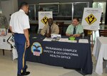 Army Command Sgt. Maj. Charles Tobin visits the McNamara Headquarters Complex Safety and Occupational Health table during the exhibits portion of DLA’s Resiliency Day Sept. 7.