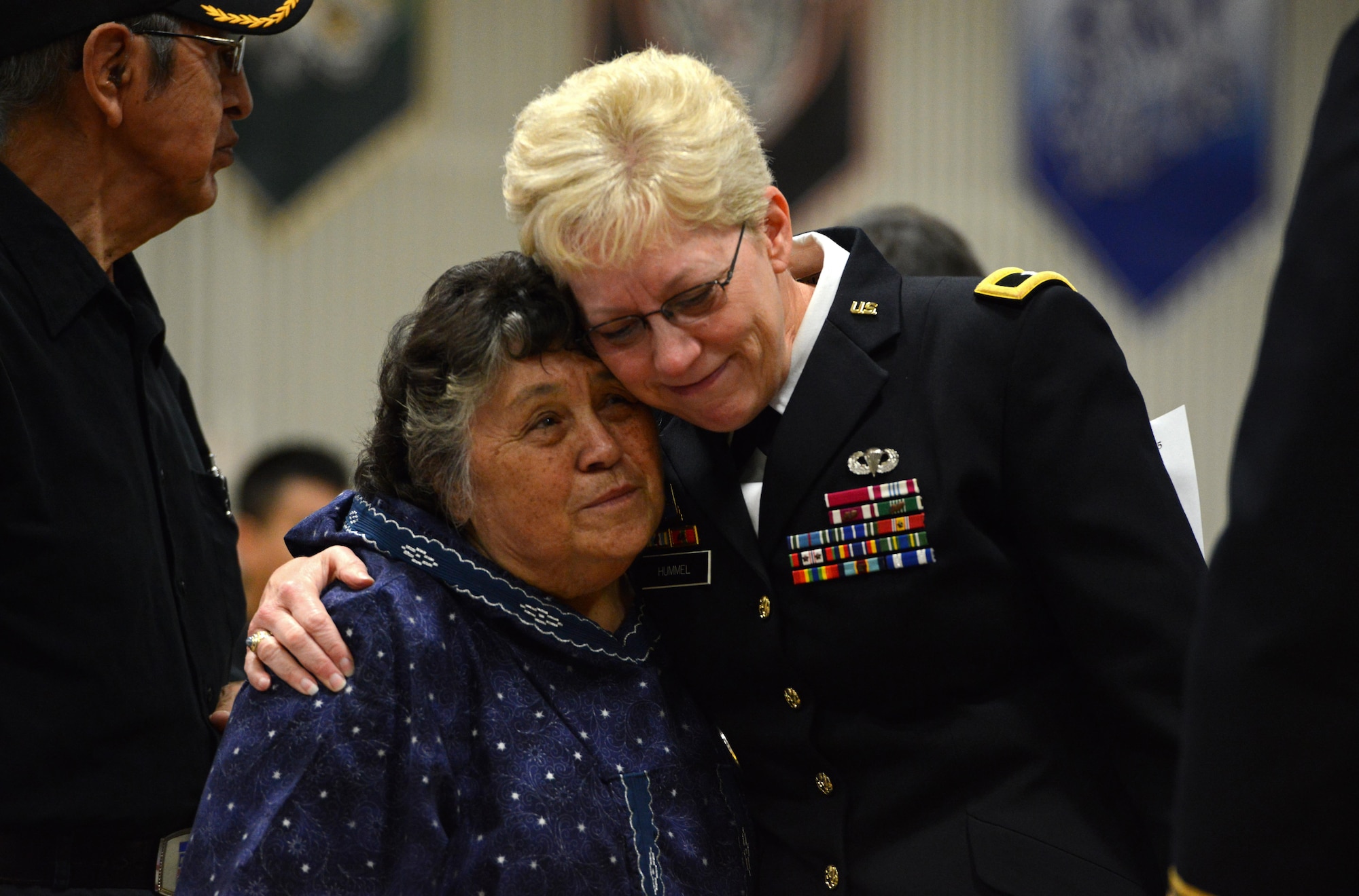 Brig. Gen. Laurie Hummel, Alaska National Guard adjutant general, embraces Mary Schaeffer, wife of former Alaska Adjutant General Maj. Gen. John Schaeffer Jr, during the late general’s memorial service at Kotzebue, Alaska, Aug. 31, 2016. Schaeffer enlisted in the Alaska National Guard in 1957, and served for 34 years.  Schaeffer was the first Alaska Native two-star general of the Alaska National Guard and commissioner of the Alaska Department of Military and Veterans Affairs. He is survived by Mary his wife of 56 years. (U.S. Air Force photo by Airman 1st Class Javier Alvarez)