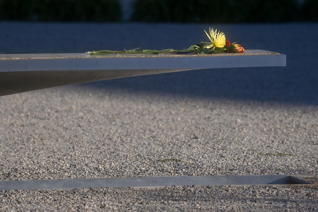 Flowers lie on a bench at the Pentagon Memorial during a ceremony, Sept. 11, 2010, marking the ninth anniversary of the 9/11 terrorist attacks. DoD photo by Cherie Cullen