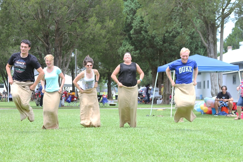 Pathways students with the Norfolk District participate in a potato sack race at the annual organization day. The Pathways program offers three types of internship opportunities to individuals who are just starting out in their potential federal careers: the Internship Program, Recent Graduates Program and Presidential Management Fellows Program (U.S. Army photo/Patrick Bloodgood)