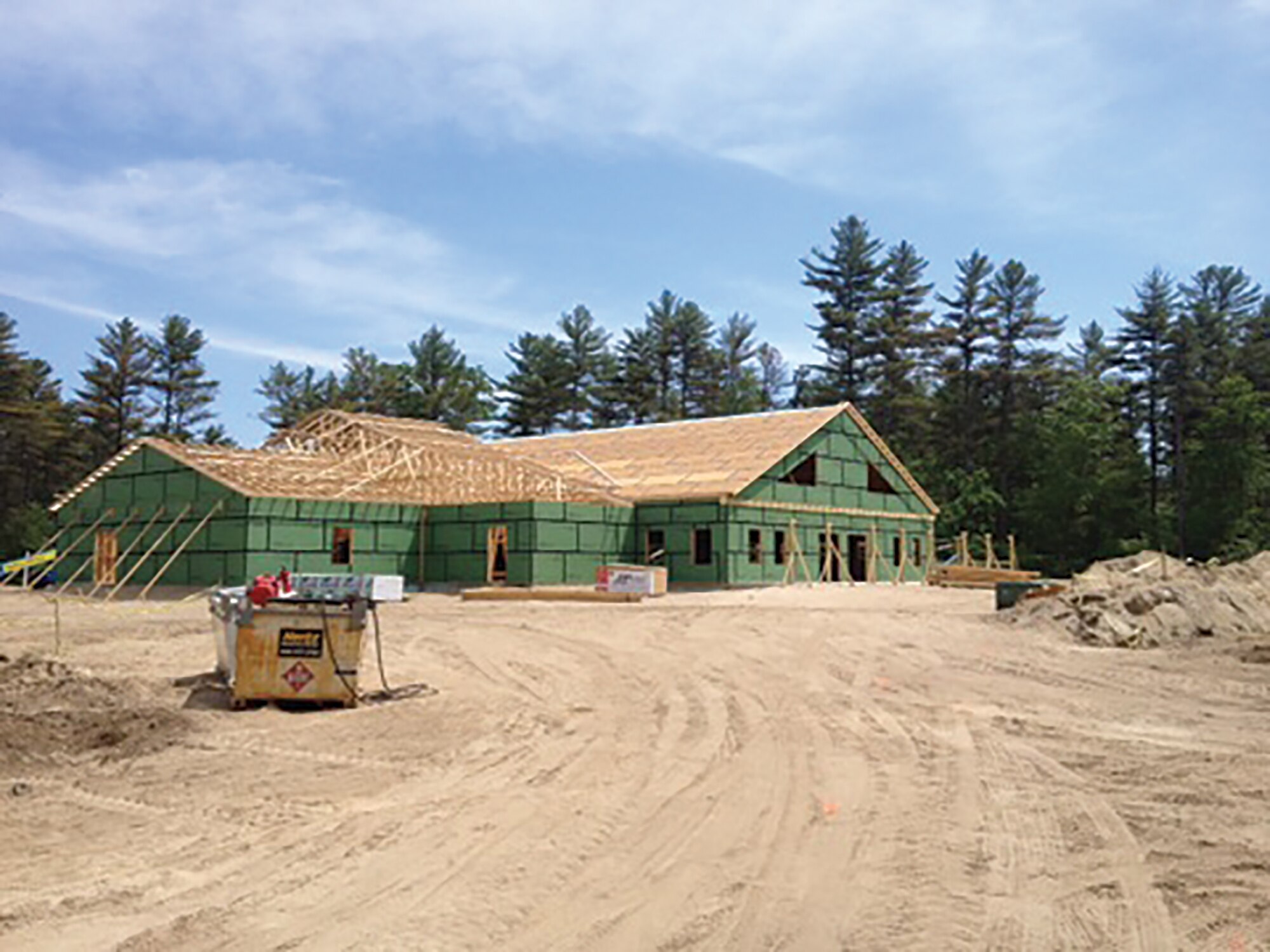 445th Civil Engineer Squadron Airmen helped construct a 20,000 square feet, multi-use building over the summer during their two-week annual tour at the Boy Scouts of America’s Camp William Hinds in Raymond, Maine. The CES Airmen helped dig drainage trenches, build wood framing for the roof and installed five layers of roof decking and 35 windows. (Courtesy photo)