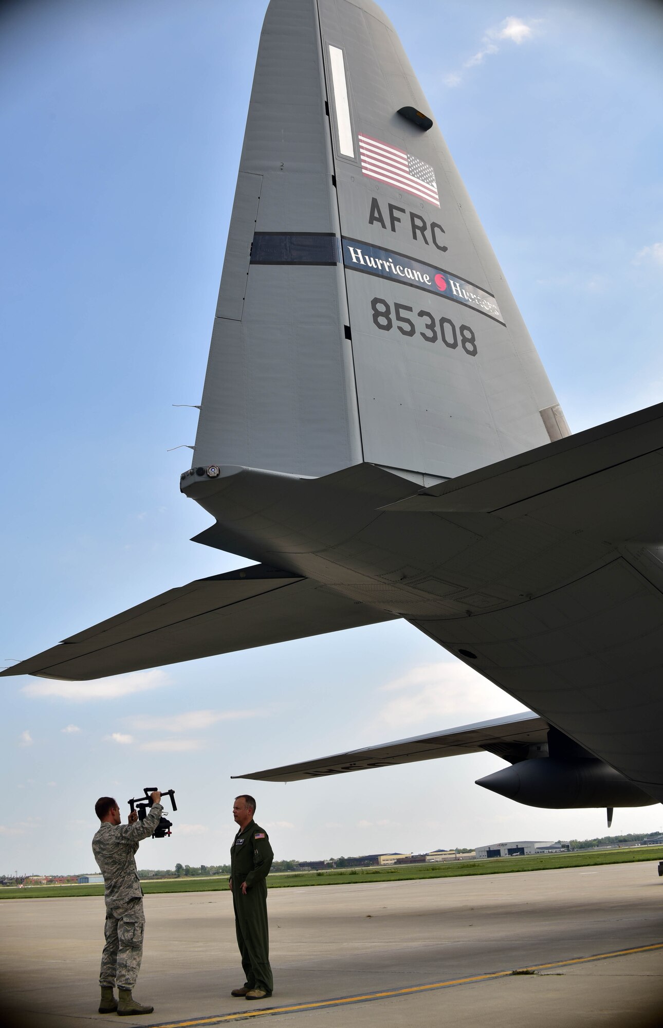 914th Airlift Wing Commander, Col. Brian S. Bowman, is interviewed by Senior Airman Joshua Williams, 914th Airlift Wing Public Affairs Broadcaster, on Tuesday, September 6, 2016 in front of a WC-130J from Keesler Air Force Base, Mississippi. The aircraft, part of the 53rd Weather Reconnaissance Squadron’s Hurricane Hunters unit, was one of four planes utilizing Niagara’s air field due to its location to Hurricane Hermine. The plane was able to receive necessary maintenance and fuel and crew members were able to receive lodging and rest allowing them to focus on their mission of monitoring and measuring Hurricane Hermine.