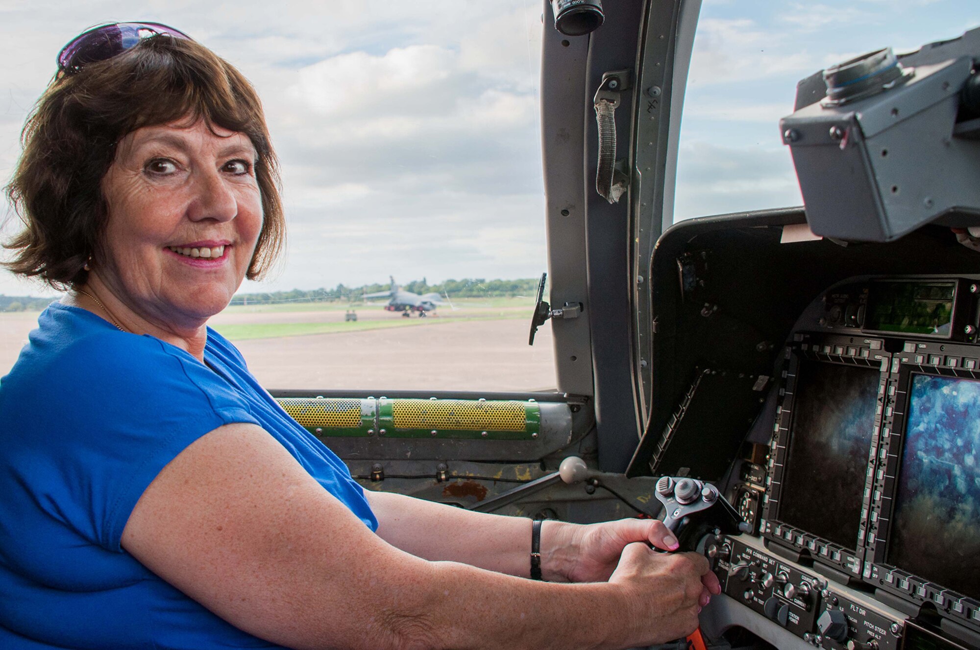 Mayor Jennie Sanford, of the town of Fairford, England, experiences the pilot's seat of a B-1B Lancer during an aircraft tour Sept. 6, 2016 at Royal Air Force Fairford, England. The Mayor along with other community leaders and base personnel were invited to tour the visiting aircraft that deployed to RAF Fairford to participate in Exercise Ample Strike, a Czech Republic led, 18 nation live exercise. (U.S. Air Force photo by 1st Lt. Monique Roux/Released)