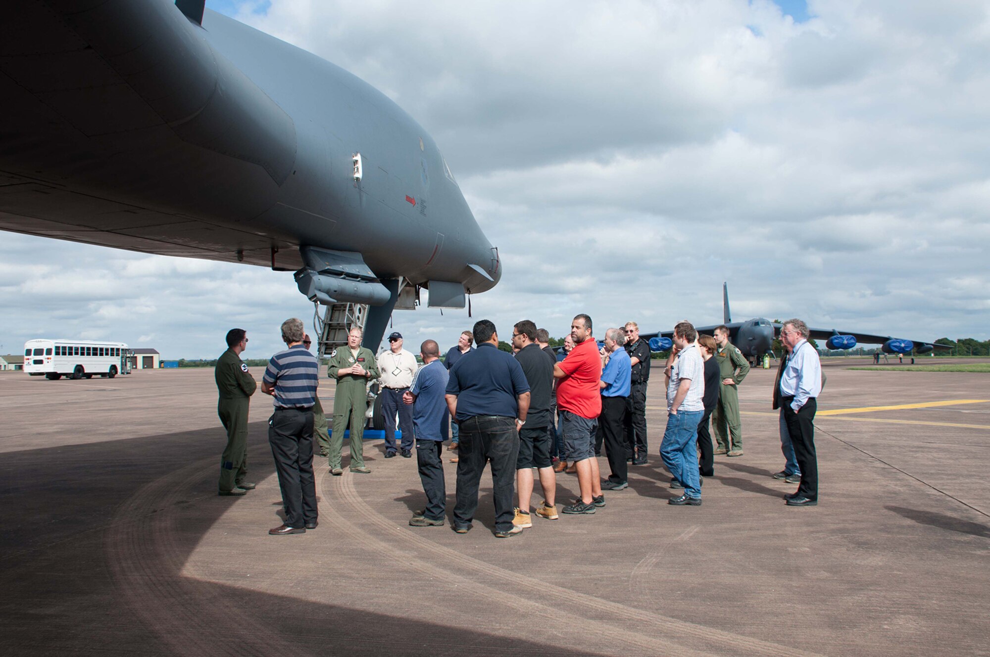 U.S. Air Force Maj. Jesse Hamilton answers questions about the B-1B Lancer for a group of personnel from Royal Air Force Fairford and members of leadership from the town of Fairford, during a base and local community static display tour Sept. 6, 2016 at RAF Fairford, England. Hamilton is a B-1 pilot assigned to the 345th Bomb Squadron, Dyess Air Force Base, Texas and deployed to RAF Fairford to participate in Exercise Ample Strike, a Czech Republic led, 18 nation live exercise.  (U.S. Air Force photo by 1st Lt. Monique Roux/Released)