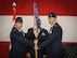 Col. Richard Land, 552nd Operations Group commander, passes the 965th Airborne Air Control Squadron guidon to Lt. Col. Alan Avriett Jr. during change of command ceremonies held Sept. 7 in Hangar 230, Dock 2.  In his previous assignment, Lieutenant Colonel Avriett was the director of operations for the 960th AACS. He is a senior air battle manager with more than 2,200 hours of flying in the E-3B/C/G and the E-8C aircraft, including 1,400 combat hours. (Air Force photo by Senior Airman Christopher J. Abad)
