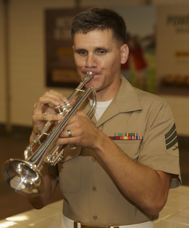 Sgt. Charles R. Mekealian, a trumpet player with Marine Corps Band New Orleans Brass Quintet performs in a New York City subway Aug. 28, 2016. The quintet’s performance was to promote the Marine Corps Reserve Centennial celebration. For 100 years, the Marine Corps Reserve has answered the call, serving as our nation’s crisis response force and expeditionary force in readiness. The centennial celebration is a way to honor that selfless service and commemorate the Marine Corps Reserve’s rich history, heritage and esprit de corps. The celebration is also a way for Reserve Marines to thank their families, employers and community for their continued support. (U.S. Marine Corps photo by Sgt. Ian Leones/Released)