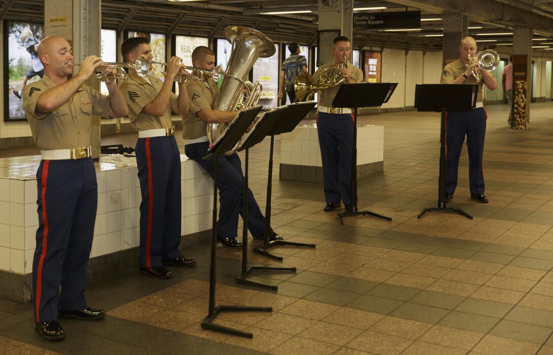 The Marine Corps Band New Orleans Brass Quintet performs in a New York City subway Aug. 28, 2016. The quintet’s performance was to promote the Marine Corps Reserve Centennial celebration. For 100 years, the Marine Corps Reserve has answered the call, serving as our nation’s crisis response force and expeditionary force in readiness. The centennial celebration is a way to honor that selfless service and commemorate the Marine Corps Reserve’s rich history, heritage and esprit de corps. The celebration is also a way for Reserve Marines to thank their families, employers and community for their continued support. (U.S. Marine Corps photo by Sgt. Ian Leones/Released)