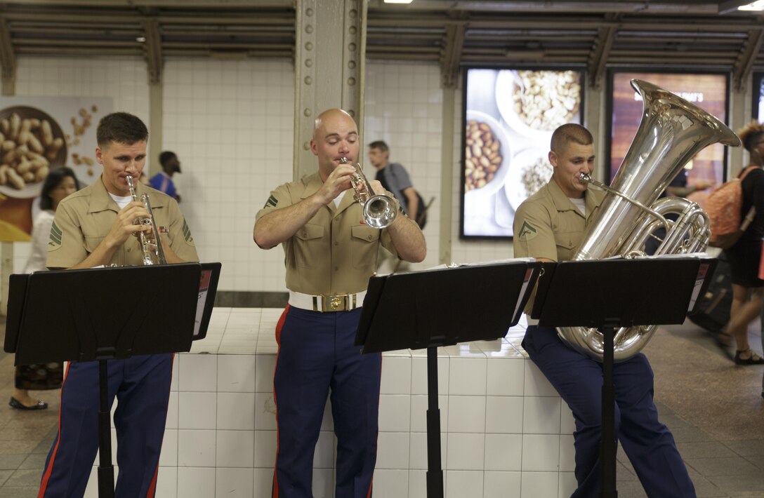 The Marine Corps Band New Orleans Brass Quintet performs in a New York City subway Aug. 28, 2016. The quintet’s performance was to promote the Marine Corps Reserve Centennial celebration. For 100 years, the Marine Corps Reserve has answered the call, serving as our nation’s crisis response force and expeditionary force in readiness. The centennial celebration is a way to honor that selfless service and commemorate the Marine Corps Reserve’s rich history, heritage and esprit de corps. The celebration is also a way for Reserve Marines to thank their families, employers and community for their continued support. (U.S. Marine Corps photo by Sgt. Ian Leones/Released)