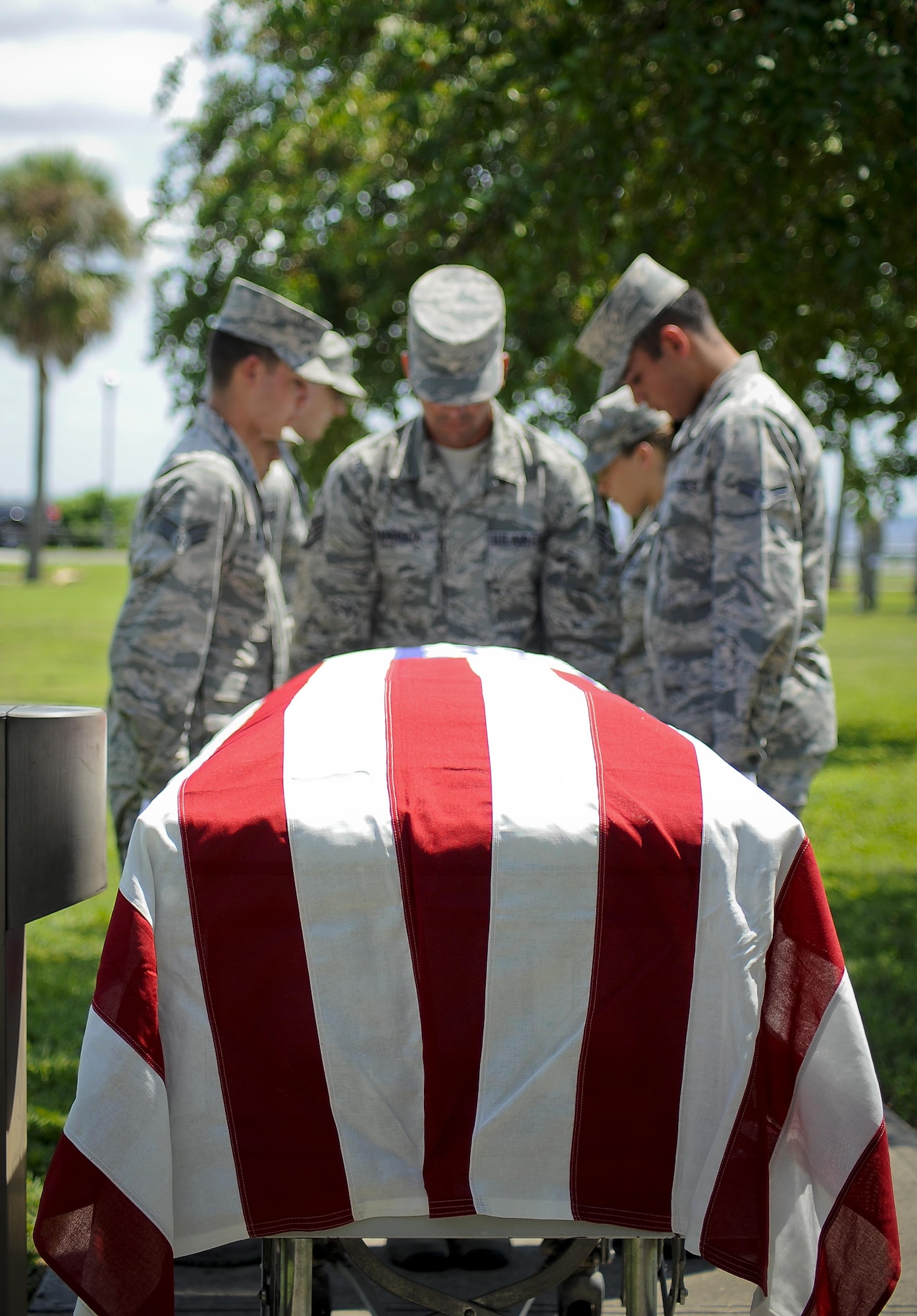 Base honor guardsmen practice pallbearer duties during an active-duty full-honors funeral demonstration at MacDill Air Force Base, Fla., Sept. 6, 2016. During the training with U.S. Air Force Honor Guard Mobile Training Team, base honor guardsmen from MacDill and surrounding areas received step-by-step instruction, followed by hands-on practice and finished with an active-duty full honors funeral demonstration. (U.S. Air Force photo by Airman 1st Class Mariette Adams)
