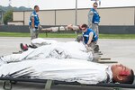 U.S. Airmen from the 51st Medical Group line up simulated injured individuals during an emergency management exercise at Osan Air Base, Sept. 7, 2016.  Airmen from the 51st Fighter Wing practiced emergency management procedures in case of situations with downed aircraft. 