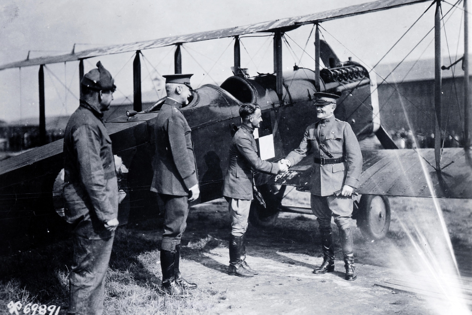 The pioneering 1920 Alaska Flight was an incredible feat of airmanship.  Air Service aircrews flew four DH-4Bs a total of 9,000 miles without loss of personnel or aircraft.  Here General Pershing congratulates Capt St. Clair Streett, the flight commander, upon his safe return.