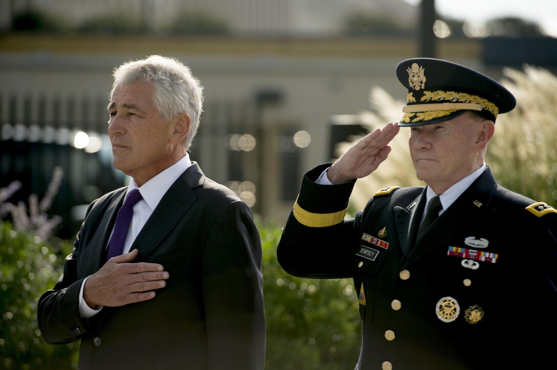 Defense Secretary Chuck Hagel, left, and Army Gen. Martin E. Dempsey, right, chairman of the Joint Chiefs of Staff, render honors to those who lost their lives during the 9/11 terrorist attack on the Pentagon during a wreath-laying ceremony at the Pentagon Memorial, Sept. 11, 2014. DoD photo by Air Force Master Sgt. Adrian Cadiz