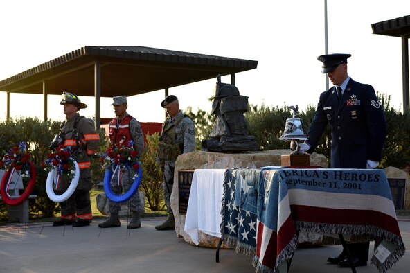 U.S. Air Force Staff Sgt. Adam McCarty, 312th Training Squadron rescue instructor, rings a ceremonial bell during the 9/11 Remembrance Ceremony at the Department of Defense Fallen Firefighter Memorial on Goodfellow Air Force Base, Texas, Sept. 9, 2016. The bell is rang to honor the deaths of emergency responders of the 9/11 attacks. (U.S. Air Force photo by Airman 1st Class Caelynn Ferguson/ Released)