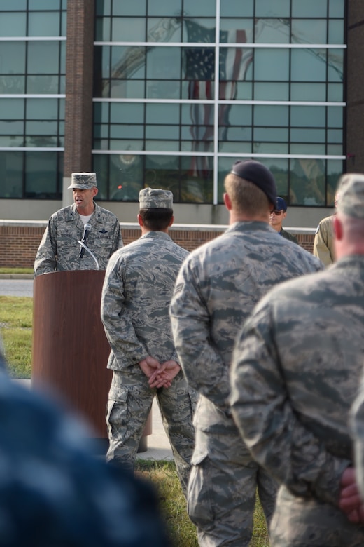 Col. E. John Teichert, 11th Wing and Joint Base Andrews commander, speaks at the 9/11 Remembrance Ceremony held at Heritage Park on Joint Base Andrews, Md., Sept. 9, 2016. Teichert spoke about the importance of paying tribute to the first responders and victims of the terrorist attacks on Sept. 11, 2001. (U.S. Air Force photo by Airman 1st Class Valentina Lopez)
