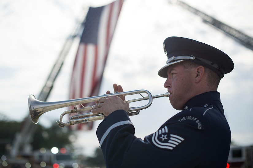 Tech. Sgt. Matthew Misener, U.S. Air Force Band trumpet player, performs at the 9/11 Remembrance Ceremony held at Heritage Park on Joint Base Andrews, Md., Sept. 9, 2016. The ceremony marked the 15th anniversary of the terrorist attacks on Sept. 11, 2001.  (U.S. Air Force photo by Senior Airman Philip Bryant)