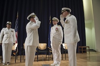 Capt. Mark Vandroff assumes the position of commanding officer relieving Capt. Rich Blank at Naval Surface Warfare Center, Carderock Division during the change of command ceremony in West Bethesda, Sept. 8, 2016. From left: Lt. Christilene Whalen, command chaplain, Naval Support Activity Bethesda; Rear Adm. Tom Druggan, commander, Naval Surface Warfare Center; Blank; and Vandroff. (U.S. Navy photo by Ryan Hanyok/Released)