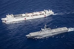 In this file photo, JS Shimokita (LST-4002) steams alongside hospital ship USNS Mercy (T-AH 19) while transiting to the third mission stop of Pacific Partnership 2016 in Da Nang, Vietnam. Upon arrival, partner nations will work side-by-side with local military and non-government organizations to conduct cooperative health engagements, community relation events and subject matter expert exchanges to better prepare for a natural disaster or crisis. 