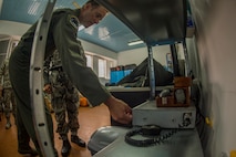 California Air National Guard Lt. Col. Matthew Ohman, a 194th Expeditionary Fighter Squadron F-15C Eagle pilot, tests a radio warning system out of their squadron’s flight operations room during joint NATO air policing at Graf Ignatievo, Bulgaria, Sept. 9, 2016. Four California and Massachusetts ANGs’ F-15Cs and approximately 75 Airmen from the 194th EFS deployed to Graf Ignatievo, Bulgaria, and will stand ready as interceptors, prepared to quickly react to any violations and infringements for policing of Bulgarian airspace Sept. 9-16, 2016. The squadron forward deployed to Graf Ignatievo from Campia Turzii, Romania, where they serve on a theater security package deployment to Europe as a part of Operation Atlantic Resolve.  (U.S. Air Force photo by Staff Sgt. Joe W. McFadden/Released)