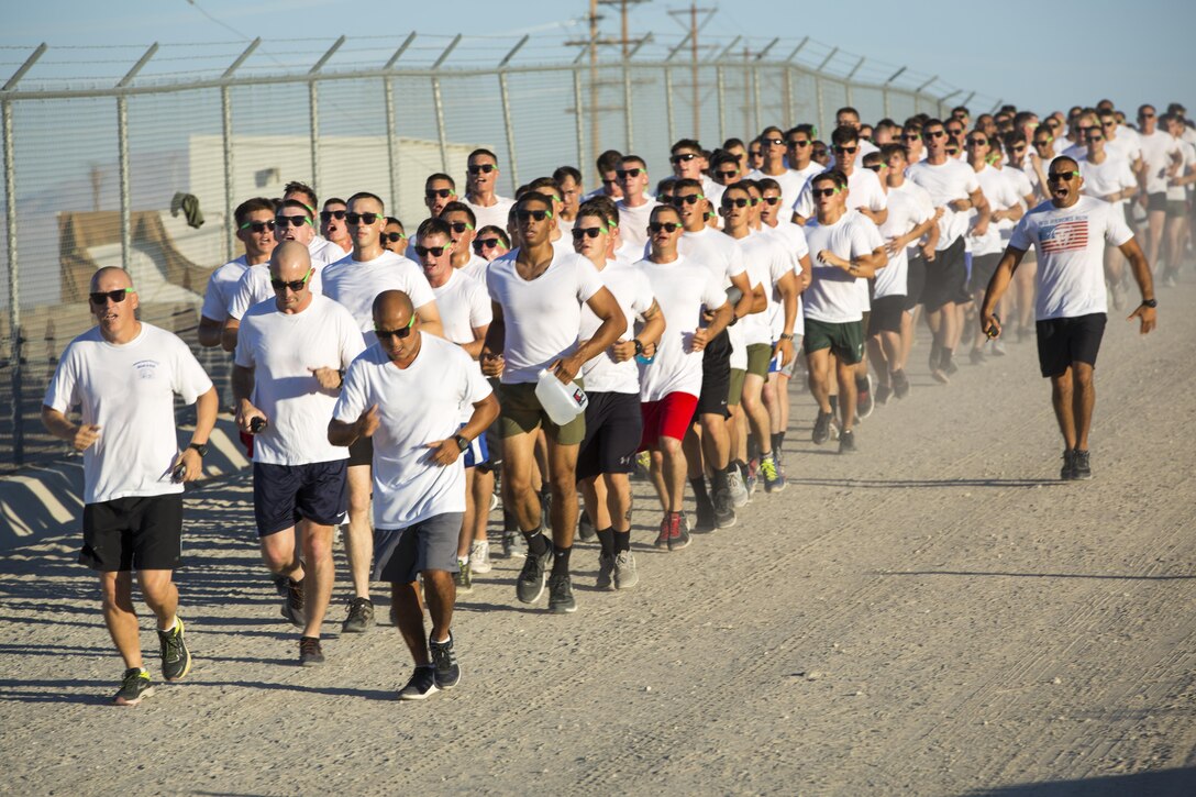 Marines and sailors with 1st Battalion, 7th Marine Regiment, participate in a battalion-wide 5k Color Run aboard Marine Corps Air Ground Combat Center, Twentynine Palms, Calif., Sept. 2, 2016. (Official Marine Corps photo by Cpl. Levi Schultz/Released)