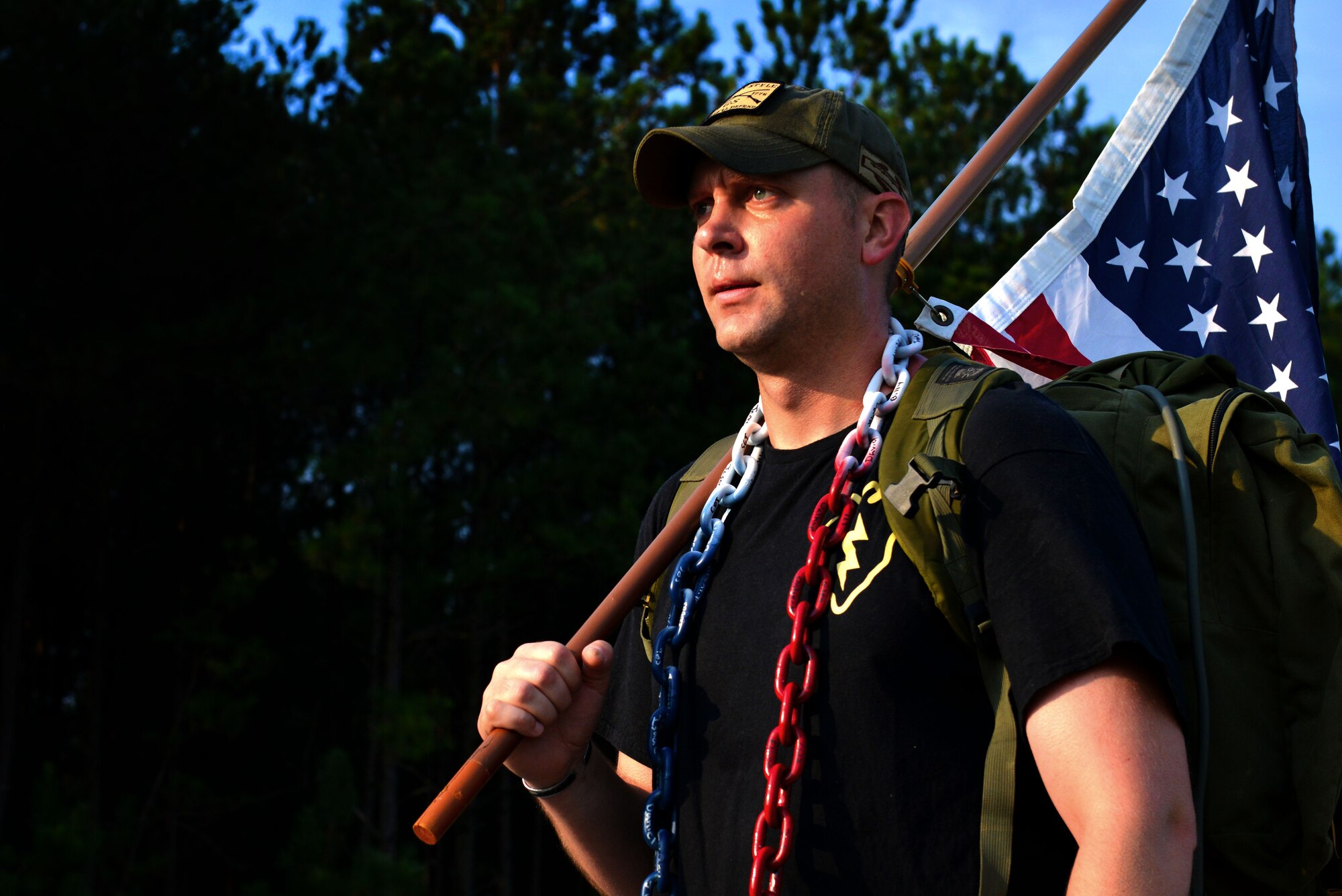U.S. Army Staff Sgt. Josh Dockery, U.S. Army Central operations noncommissioned officer in charge, holds an American flag during a 9/11 Memorial Ruck/Walk at Shaw Air Force Base, S.C., Sept. 9, 2016. Approximately 80 participants rucked 9.11 miles in commemoration of those who lost their lives on Sept. 11, 2001. (U.S. Air Force photo by Airman 1st Class Destinee Sweeney)