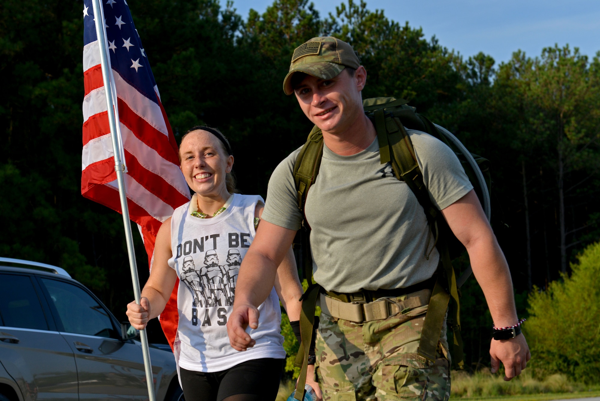 Ruck participants carry an American flag during a 9/11 Memorial Ruck/Walk at Shaw Air Force Base, S.C., Sept. 9, 2016. The 20th Civil Engineer Squadron explosive ordnance disposal flight hosted the ruck in remembrance of fallen brothers and sisters. (U.S. Air Force photo by Airman 1st Class Destinee Sweeney)