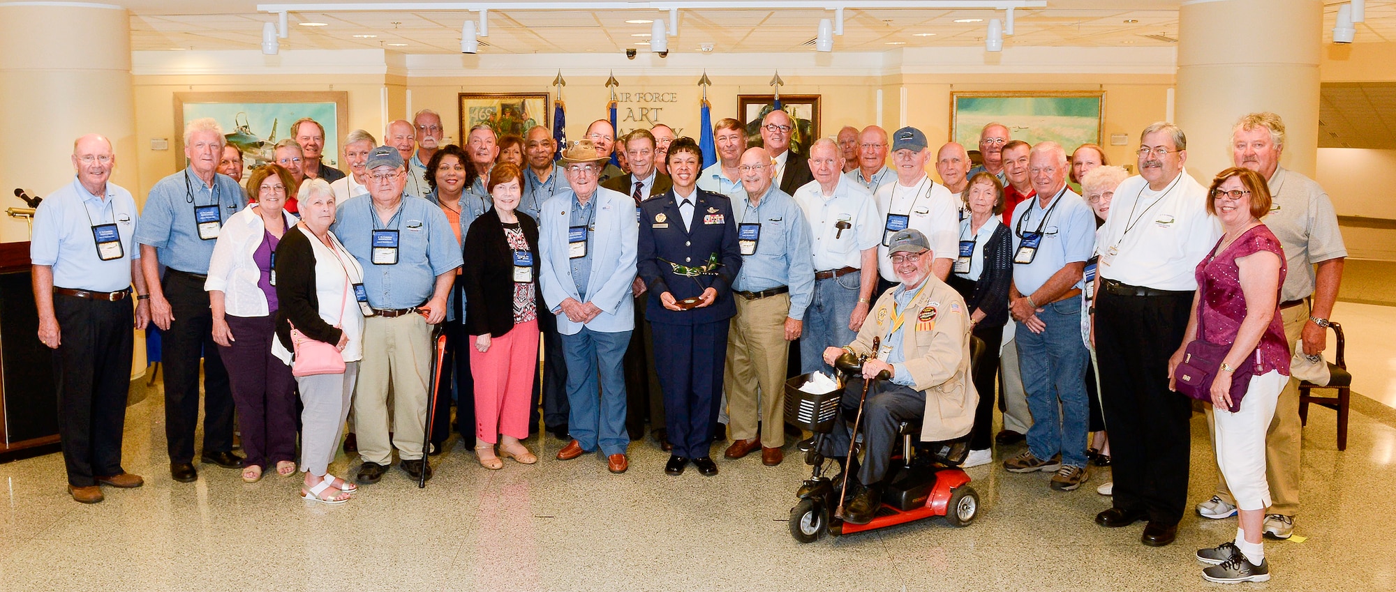 Lt. Gen. Stayce D. Harris, the Air Force assistant vice chief of staff, stands with C-7A Caribou crewmembers and support personnel, and their families, during a ceremony at the Pentagon in Washington, D.C., Sept. 9, 2016. More than 30 Caribou veterans attended the ceremony. (U.S. Air Force photo/Andy Morataya)