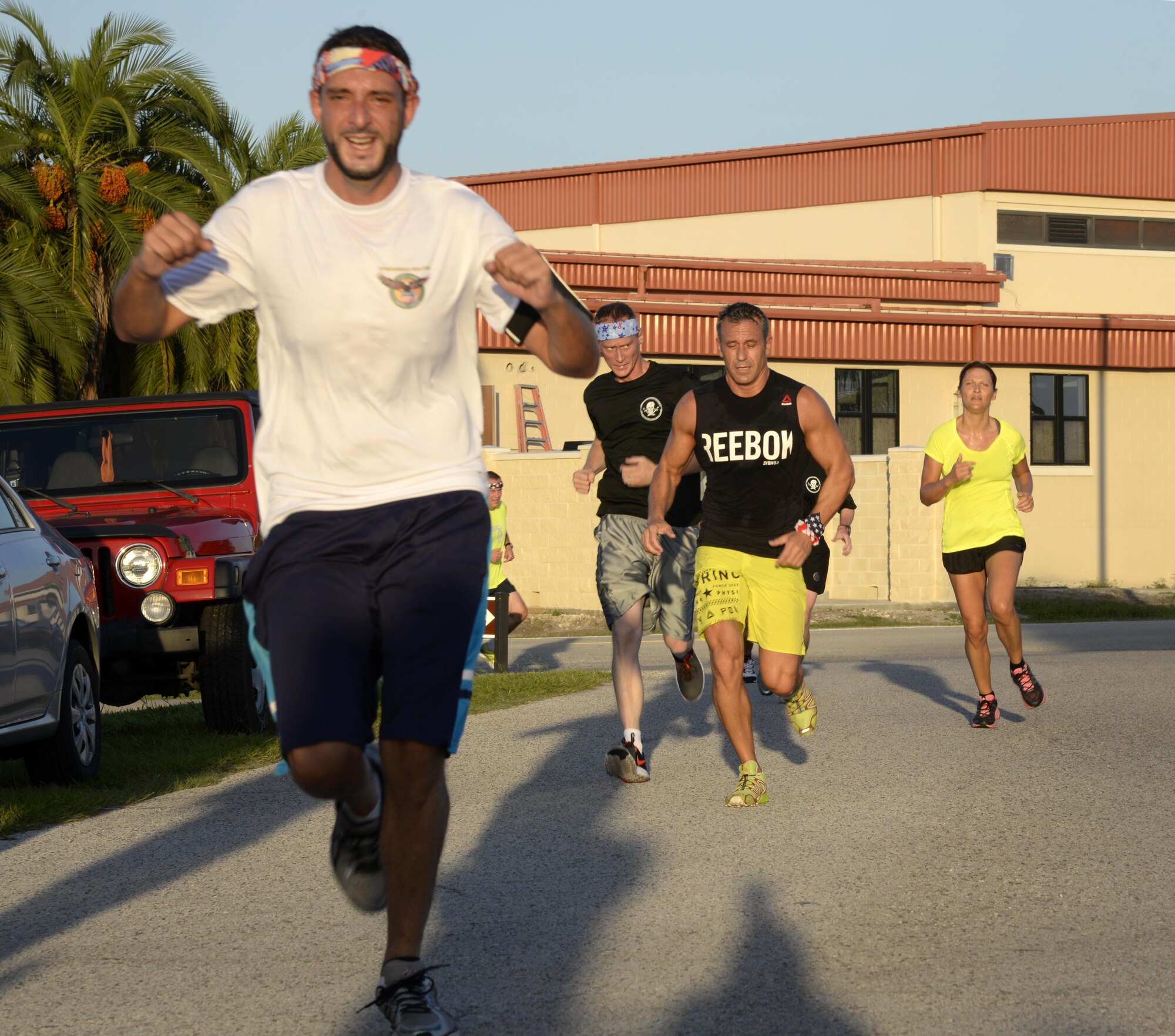 Members of Team MacDill race through the 9/11 Memorial 5K finish line at MacDill Air Force Base, Fla., Sept. 9, 2016. Approximately 180 personnel participated in the run which was in remembrance of the lives lost in the Sept. 11, 2001 terrorist attacks. (U.S. Air Force photo by Tech. Sgt. Krystie Martinez)
