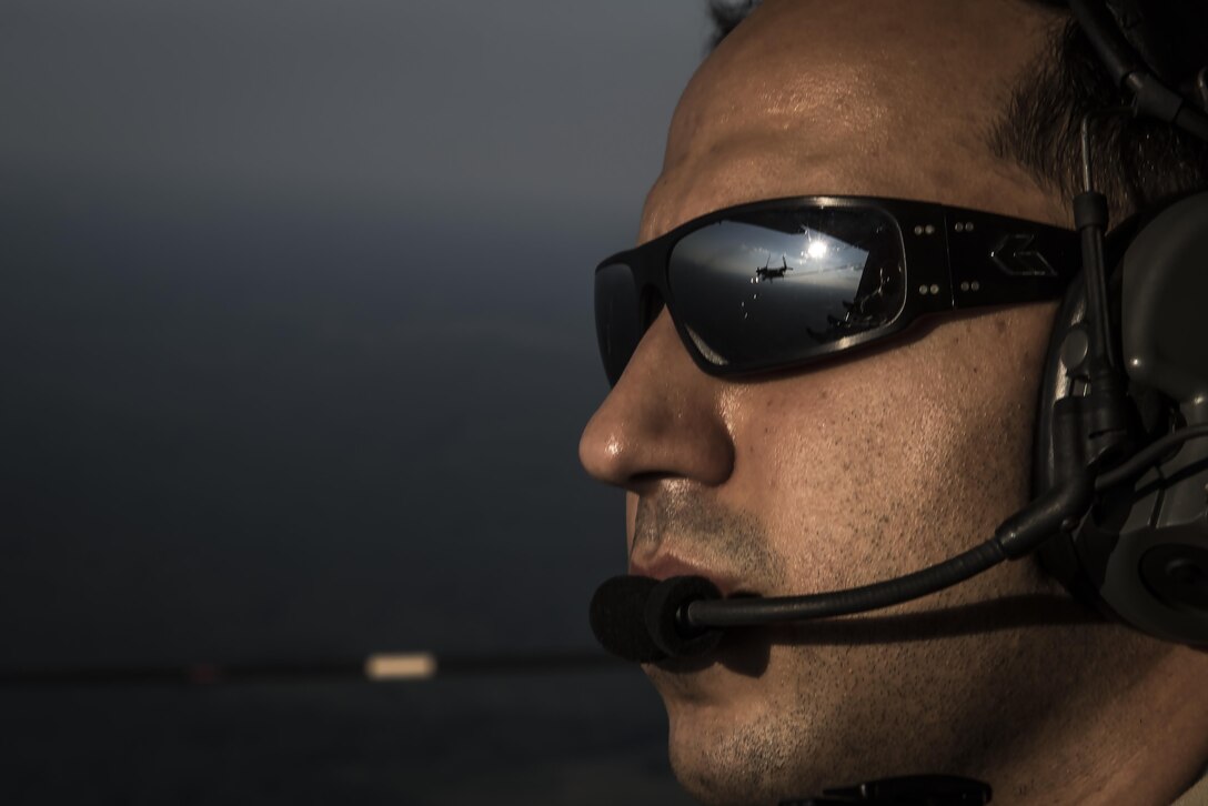 Staff Sgt. Anwar Hasan, a loadmaster with the 15th Special Operations Squadron, scans the sky while a CV-22 Osprey tiltrotor aircraft approaches an air-refueling receptacle during a refueling mission at Hurlburt Field, Fla., Sept. 7, 2016. The Osprey is a tiltrotor aircraft that combines the vertical takeoff, hover and vertical landing qualities of a helicopter with the long-range, fuel efficiency and speed characteristics of a turboprop aircraft. (U.S. Air Force photo by Staff Sgt. Christopher Callaway)